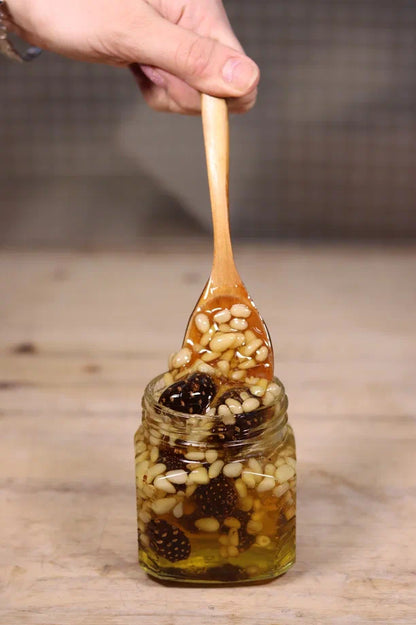 Honey mix with pine nuts and pine cones